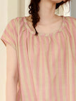 Pink stripe cotton loungewear worn
