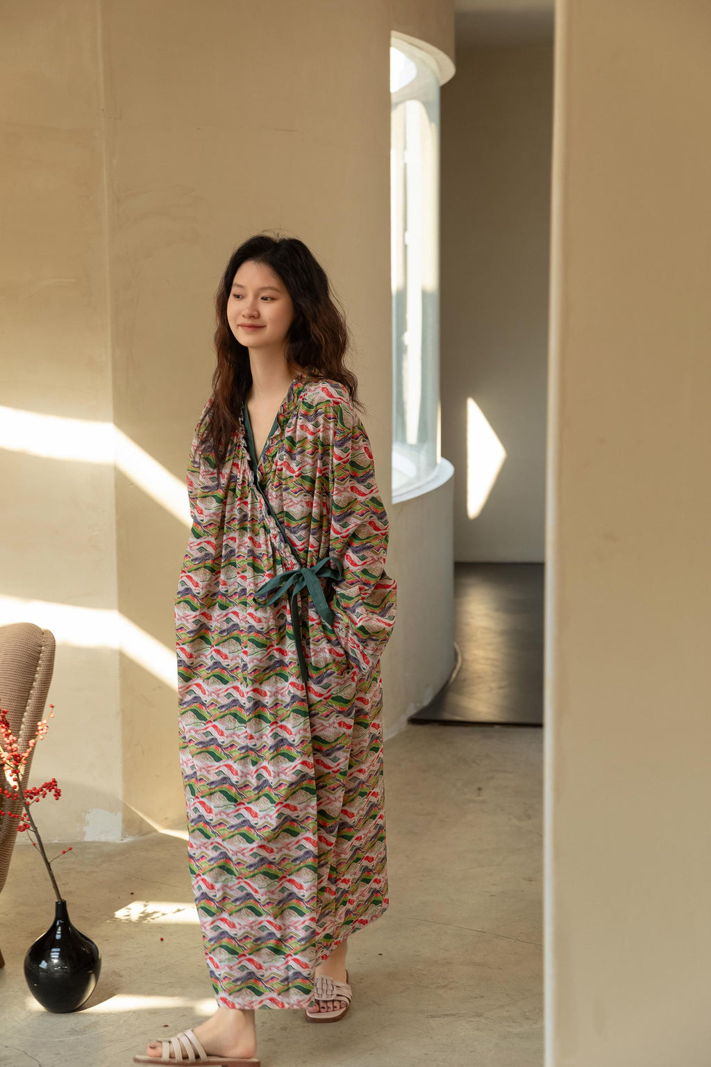 Model wearing an elegant bamboo cotton robe with oriental patterns, featuring a relaxed fit and a green sash, perfect for loungewear and home comfort