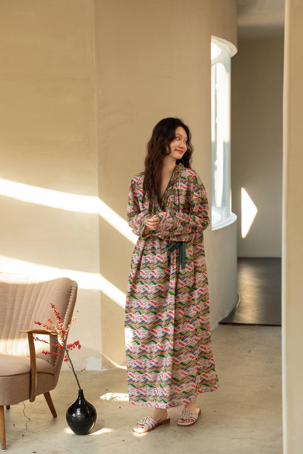 Model wearing an elegant bamboo cotton robe with oriental patterns, featuring a relaxed fit and a green sash, perfect for loungewear and home comfort