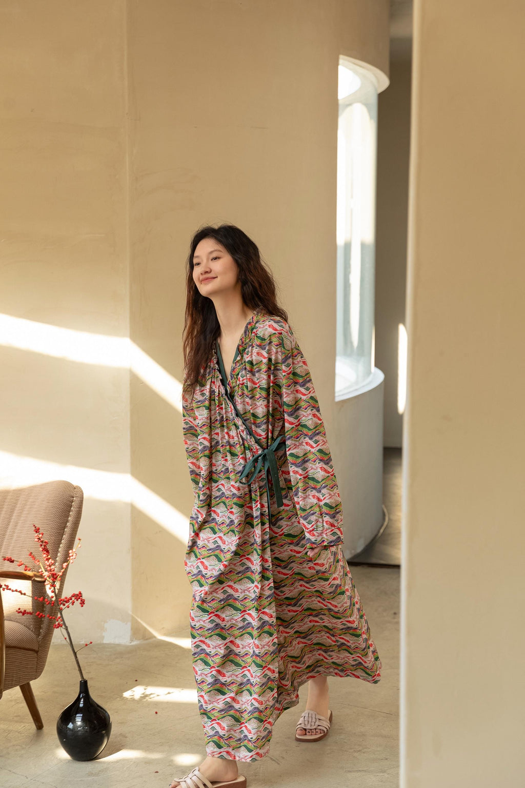 Model wearing an elegant bamboo cotton robe with oriental patterns, featuring a relaxed fit and a green sash, perfect for loungewear and home comfort