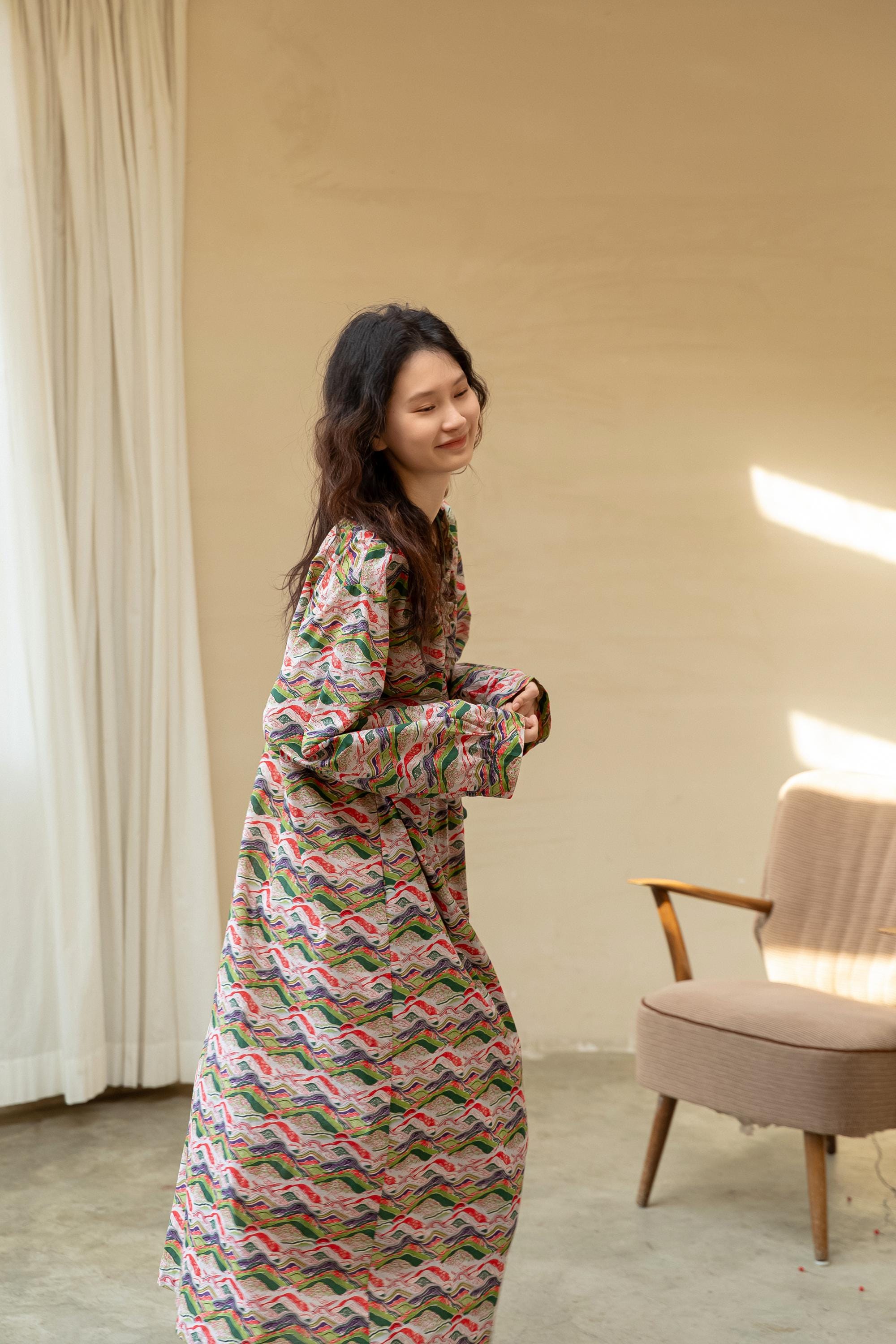 Model wearing an elegant bamboo cotton robe with oriental patterns, featuring a relaxed fit and a green sash, perfect for loungewear and home comfort