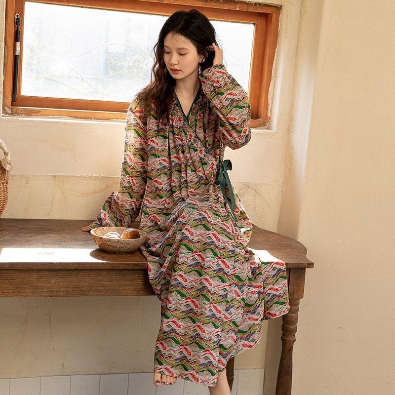 Model wearing an elegant bamboo cotton robe with oriental patterns, featuring a relaxed fit and a green sash, perfect for loungewear and home comfort