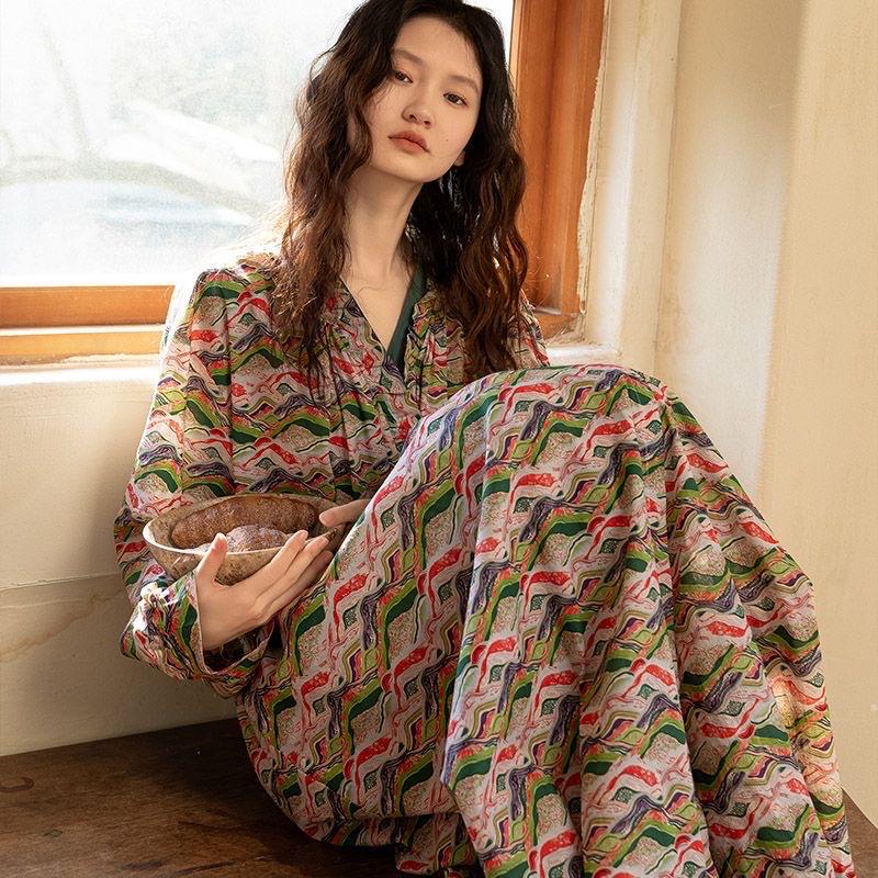 Model wearing an elegant bamboo cotton robe with oriental patterns, featuring a relaxed fit and a green sash, perfect for loungewear and home comfort