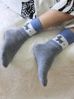 Set of four natural merino wool and cotton blend socks in two color themes, perfect as Christmas gift box and stocking fillers.