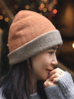 Lian Loungewear dark brown and oatmeal cashmere beanie, two-tone knit winter hat with cozy, soft texture and ribbed design.