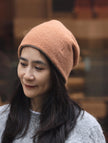 Dark brown and oatmeal two-tone cashmere beanie by Lian Loungewear, cozy knit winter hat with soft, warm texture.