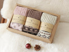 Three pairs of Scandinavian Merino wool socks in a gift box set by Lian Loungewear, showcasing cozy, soft wool socks for winter.