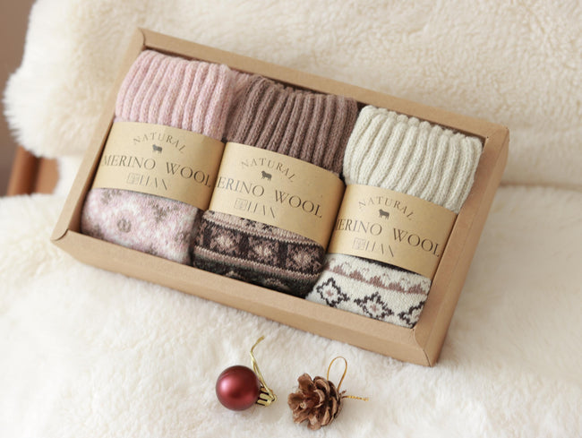 Three pairs of Scandinavian Merino wool socks in a gift box set by Lian Loungewear, showcasing cozy, soft wool socks for winter.