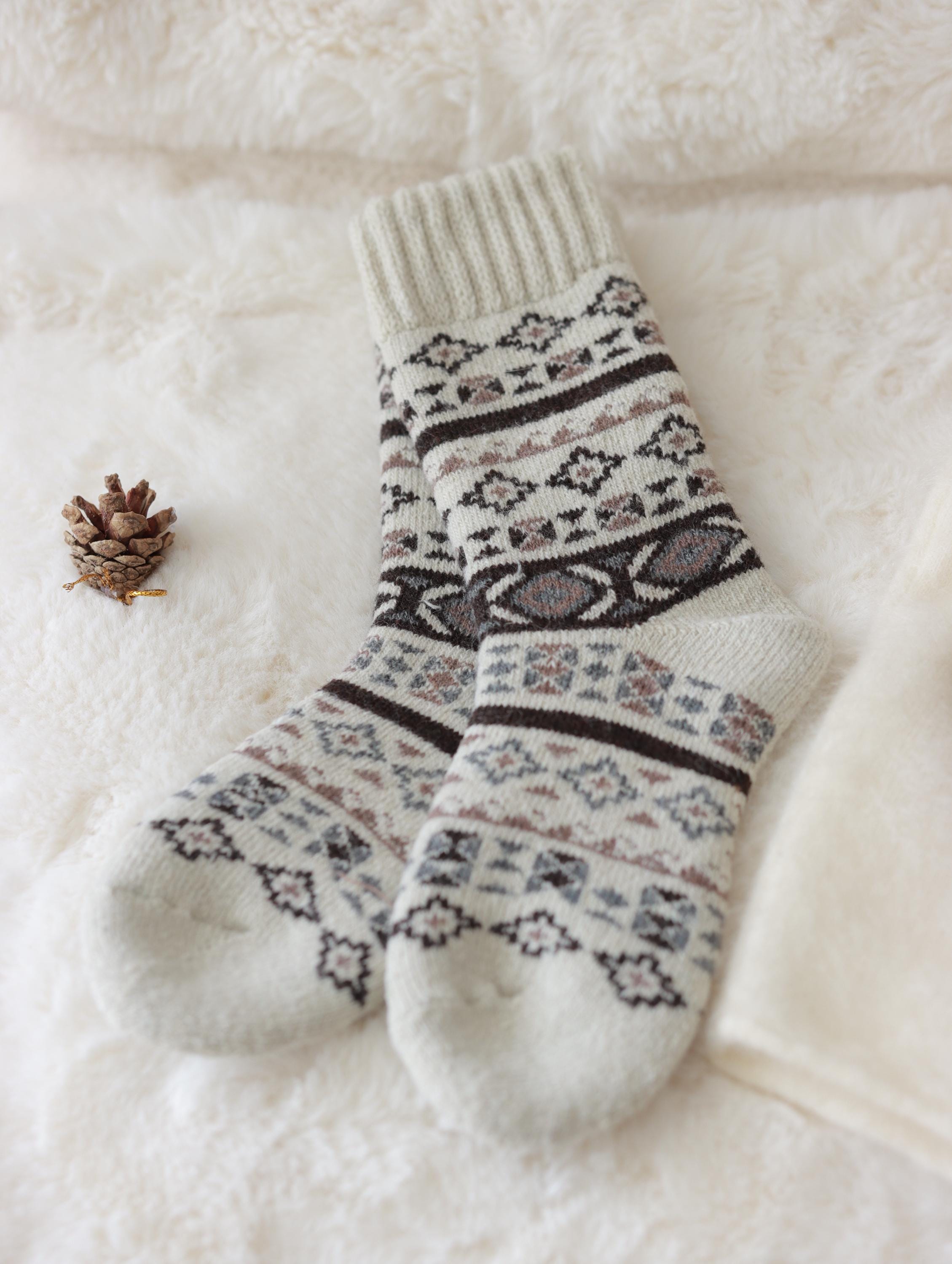 Three pairs of Scandinavian merino wool socks by Lian Loungewear in a gift box set, showcasing cozy, warm knit designs.