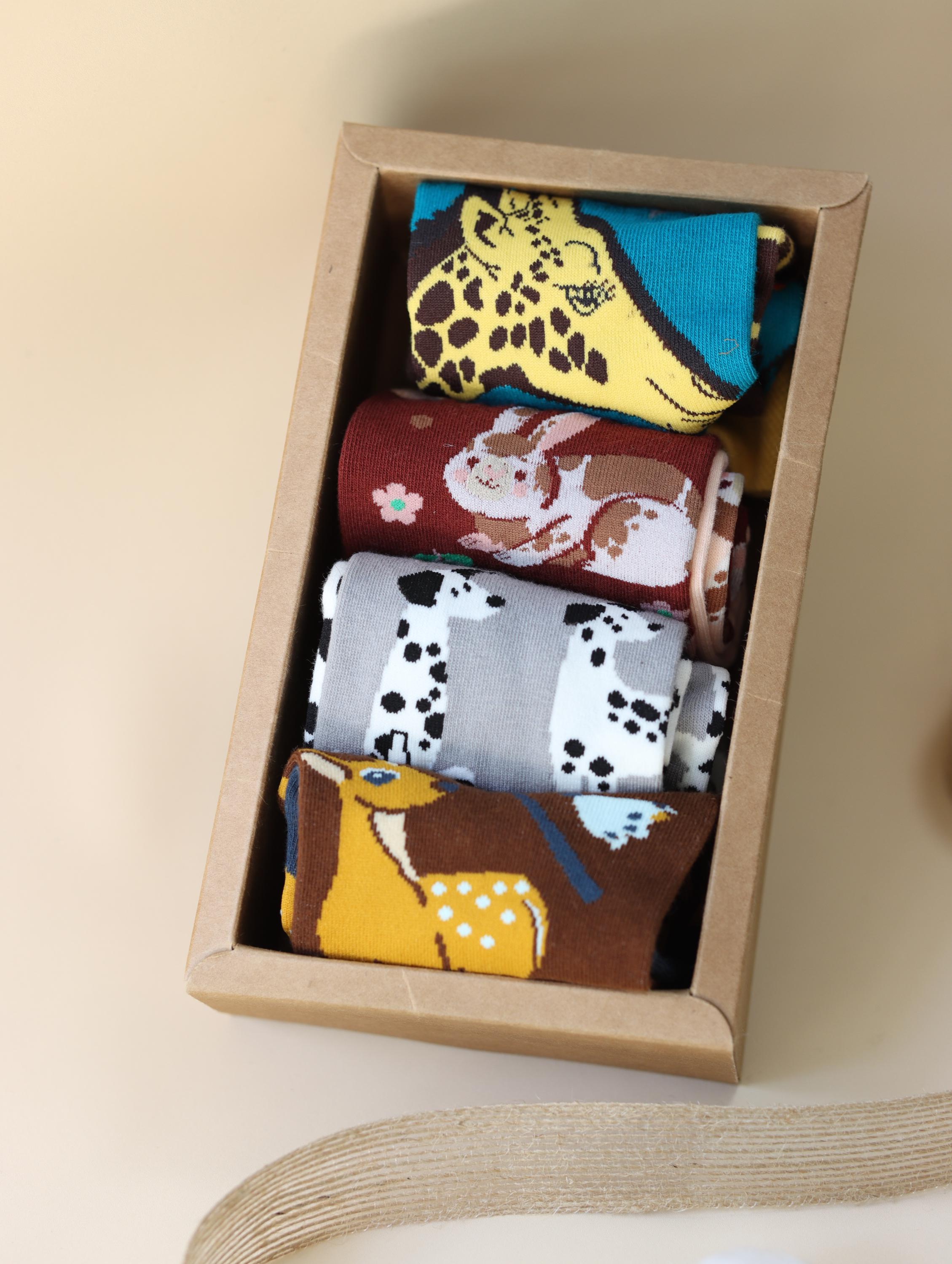 Cotton blend funny mismatched socks by Lian Loungewear featuring animal and graphic designs in a gift box set.