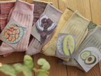 Set of two organic cotton crew socks featuring fruit plant-dyed designs from Lian Loungewear, UK size 3-7, with grape motif.
