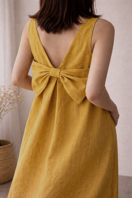 Green linen maxi dress with bow back detail by Lian Loungewear, showcasing a relaxed washed linen loungewear style.