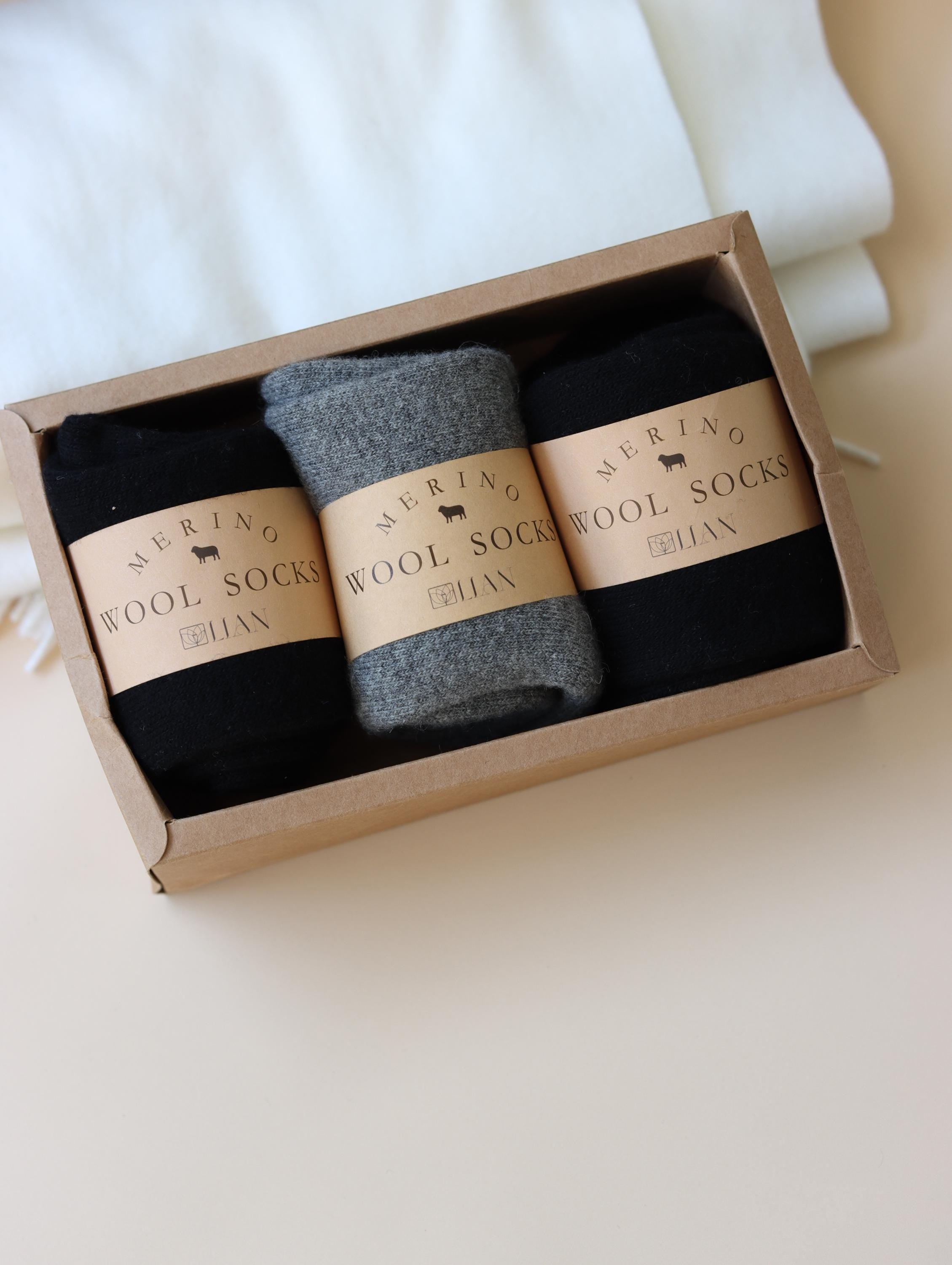 Lian Loungewear 98% Merino Wool Socks gift box with three pairs of cozy, natural-colored wool socks for men and women.