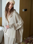 Beige cotton loungewear set for women with button-down pajamas, by Lian Loungewear, shown on a model.
