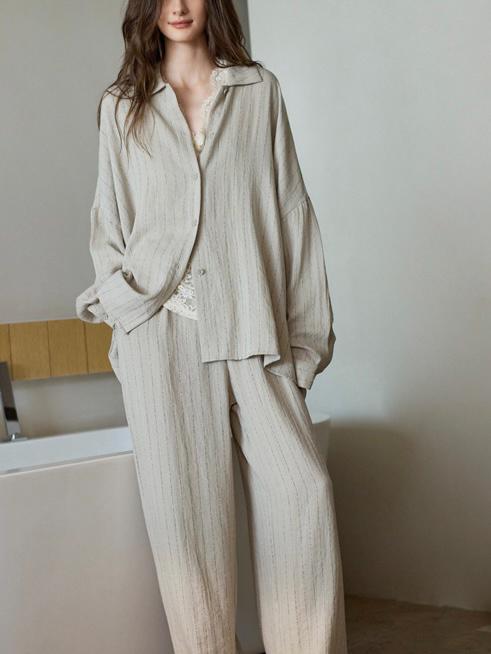 Beige cotton loungewear set for women featuring button-down pajamas, from Lian Loungewear. Comfortable and relaxed fit.