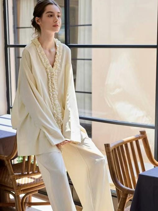 Creamy yellow cotton loungewear set by Lian Loungewear featuring relaxed fit pajamas with two collar styles for winter comfort.