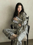 Women's floral cotton pajama set with lace trim from Lian Loungewear, showcasing cozy loungewear with a relaxed fit and floral pattern.
