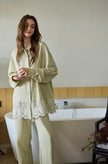 Lian Loungewear women's sage cotton loungewear set with lace hem, two-piece pajamas, comfortable and stylish for relaxing at home.