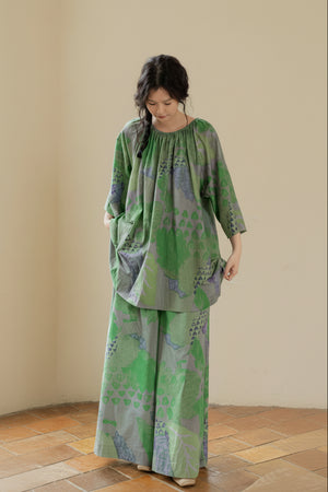 Green bamboo cotton loungewear set by Lian Loungewear with botanical print and oversized fit, featuring relaxed pants and top.
