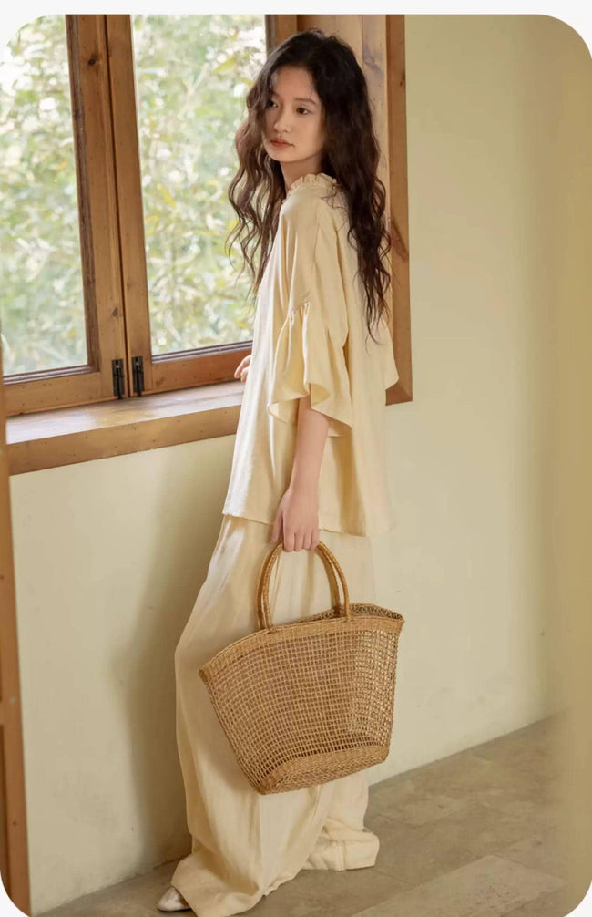 Butter yellow bamboo lounge set with ruffle sleeves from Lian Loungewear, featuring comfortable, stylish loungewear for relaxing.