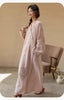 Lian Loungewear Japanese kimono robe made of embroidered cotton gauze with intricate floral patterns and wide sleeves.
