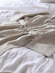 Lian Loungewear custom colour 100% linen maxi dress with relaxed fit, V-neck, and adjustable waist tie, made from natural linen fabric.
