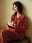 Organic gauze cotton pajama set by Lian Loungewear in muted red, featuring a round collar for cozy Christmas loungewear.