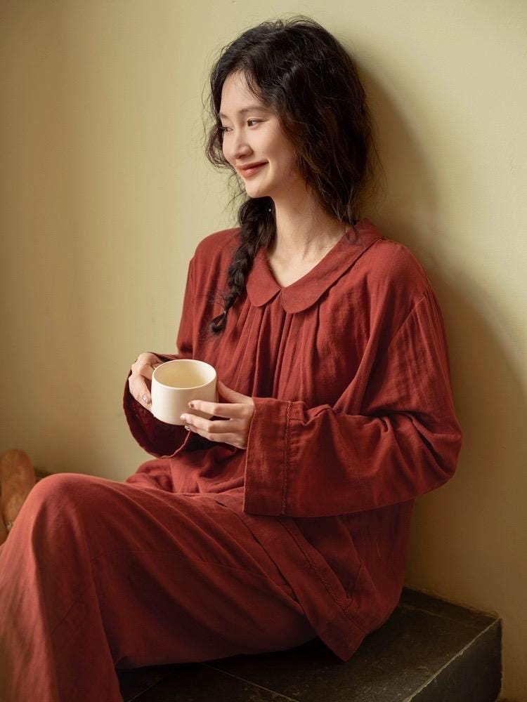 Organic gauze cotton pajama set by Lian Loungewear in muted red, featuring a round collar for cozy Christmas loungewear.