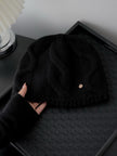 Wine red 100% Merino wool cable knit beanie for women, soft and warm winter hat with a snug fit and cozy knitted design.