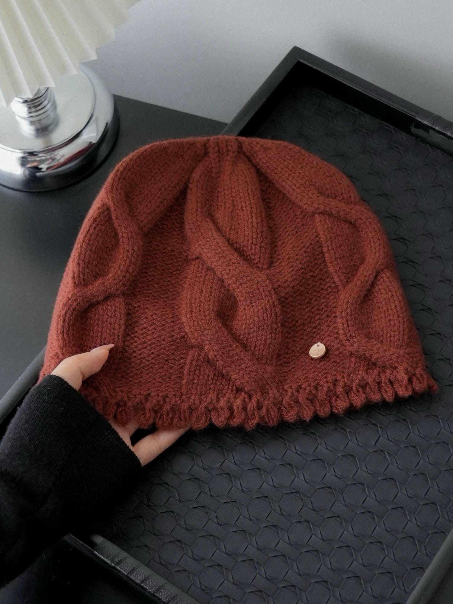 Wine red 100% Merino Wool cable knit beanie by Lian Loungewear, soft and warm winter hat for women with a cozy knitted design.