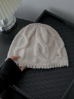 Wine red 100% Merino wool cable knit beanie for women, soft and warm winter hat with a cozy knitted design by Lian Loungewear.